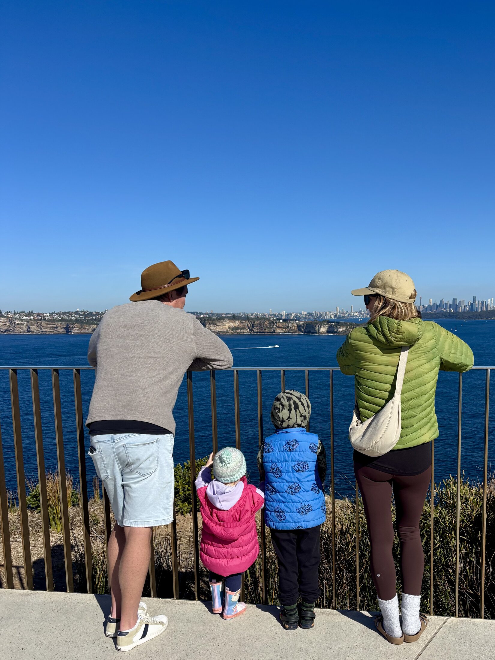 A family looking out over the ocean together